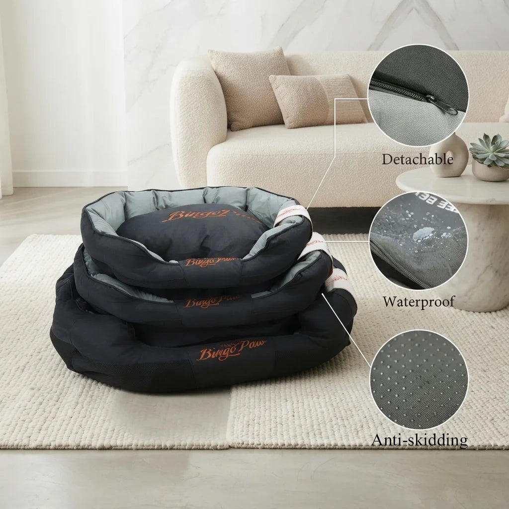A high-end lifestyle product shot featuring the Calmingpetshop Orthopedic Sofa Dog Bed for Large Dogs, highlighted as a durable waterproof orthopedic dog bed xxl. The image displays a nested set of three BingoPaw black and grey orthopedic dog beds resting on a cream-colored bouclé rug in a minimalist living room with a cream sofa and marble accents. Three circular callouts connected by lines showcase key features: a zipper for the detachable cover, water beading on the waterproof fabric, and a dotted rubber